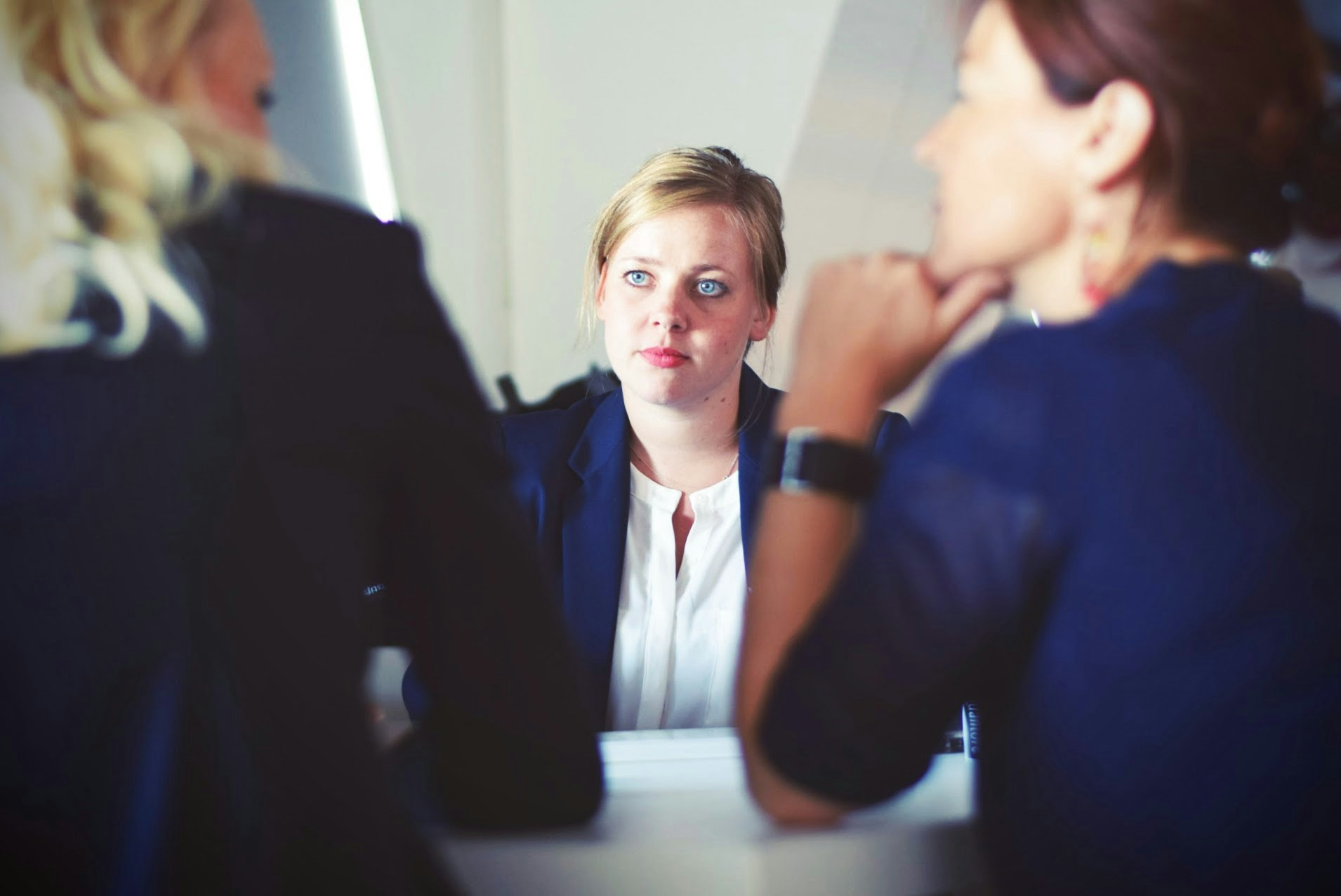Serious discussion between three business professionals.